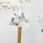 Fluffy Winter kiss-cut sticker on a pencil: bunnies on a snowy hill with pine trees