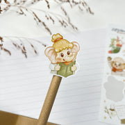 Tuk Tuk and Stroop Winter kiss-cut sticker on a pencil: Stroop reading a book