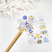 Winter Knitting kiss-cut sticker on a pencil: a ball of blue yarn with a knitting pattern card
