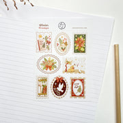Winter Stamps sticker sheet, A6, on lined paper with a pencil