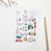 Winter Village sticker sheet, A6, on lined paper with a pencil