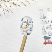 Winter Village kiss-cut sticker on a pencil: a snowy blue house with a lantern
