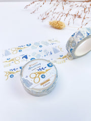 Winter Knitting washi tape roll with its label, 15mm x 10m, strips of tape behind it