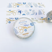 Winter Knitting washi tape roll seen from above, label with name and 15mm x 10m, strips of tape beside it