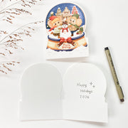 Snowy Amsterdam Christmas card opened, English front with the blank inside and a pen