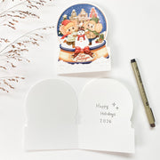 Snowy Amsterdam Christmas card opened, Dutch front with the blank inside and a pen