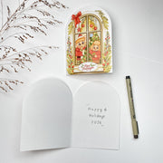 Window Frame Christmas card opened, Dutch front with the blank inside and a pen
