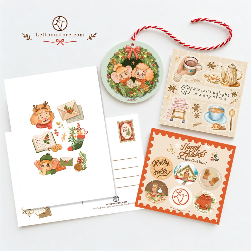 Four exclusive winter freebies: two small sticker sheets on textured paper, a postcard and a waterproof sticker, included with a full pack