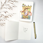 You Wrapped That Yourself Christmas card opened, with the blank inside and a pen