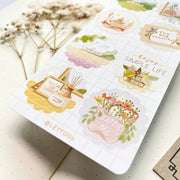 Premium Handmade Sticker Sheet A Day At Home 105mm x 148mm - a sheet on the table with a white flower branch, an opened notebook