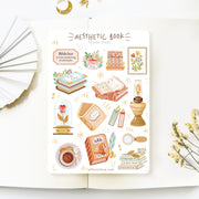 Premium Handmade Sticker Sheet Aesthetic Book 105mm x 148mm - a sheet on the table with a white flower branch, an opened notebook