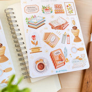 Premium Handmade Sticker Sheet Aesthetic Book 105mm x 148mm - 2 sheets on the table with a plant branch, an opened notebook