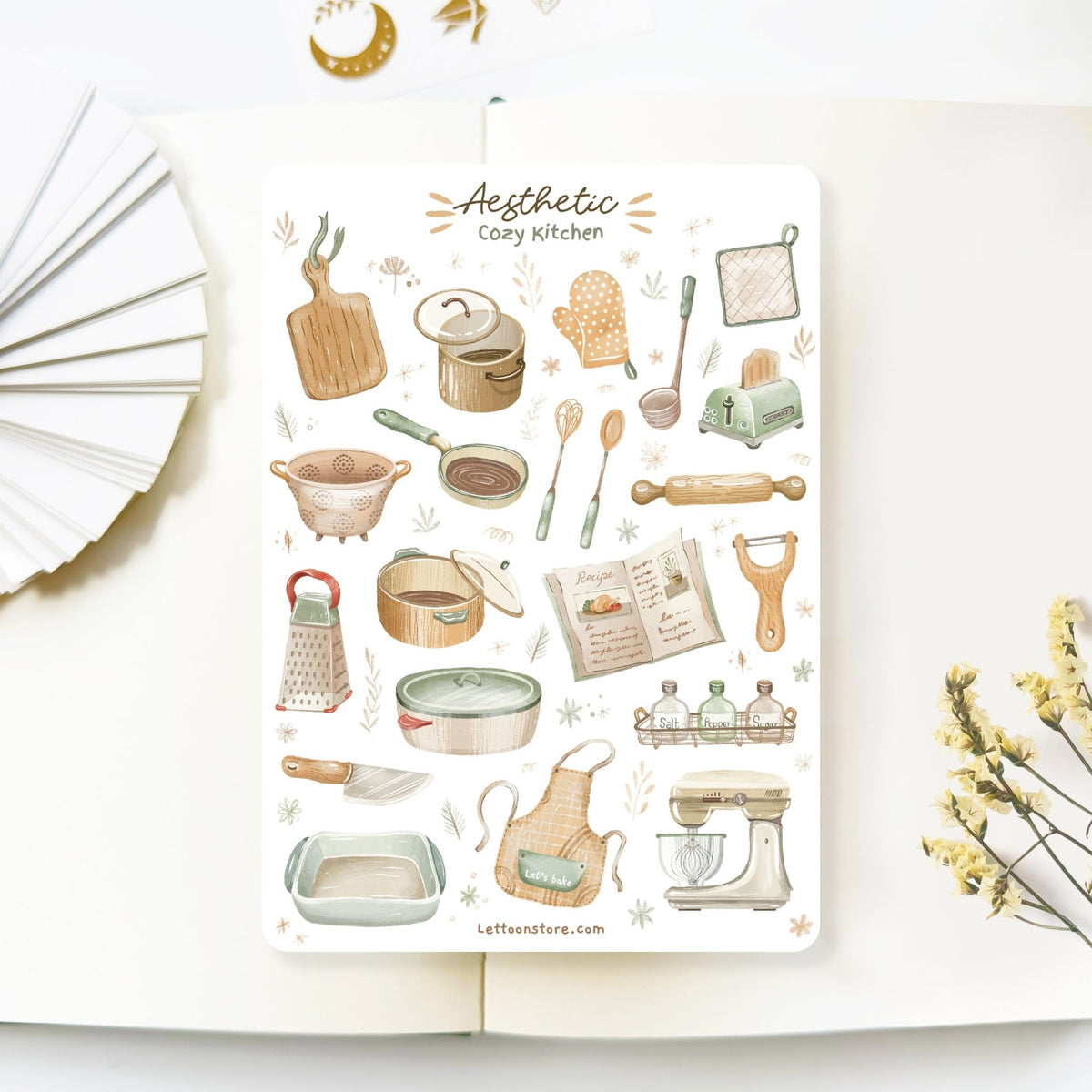Premium Handmade Sticker Sheet Aesthetic Cozy Kitchen 105mm x 148mm - a sheet on the table with a white flower branch, an opened notebook