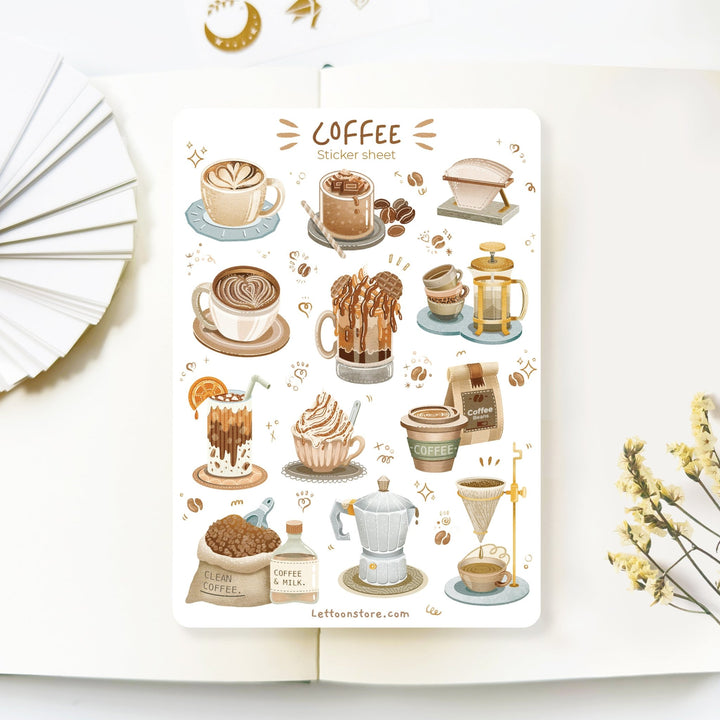 Premium Handmade Sticker Sheet Coffee 105mm x 148mm - a sheet on the table with a white flower branch, an opened notebook