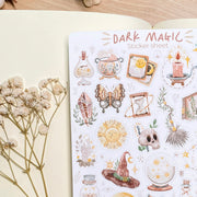 Premium Handmade Sticker Sheet Dark Magic 105mm x 148mm - a sheet on the table with a white flower branch, an opened notebook