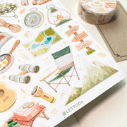 Premium Handmade Sticker Sheet Into The Wild 105mm x 148mm - a sheet on the table with a washi tape, an opened notebook