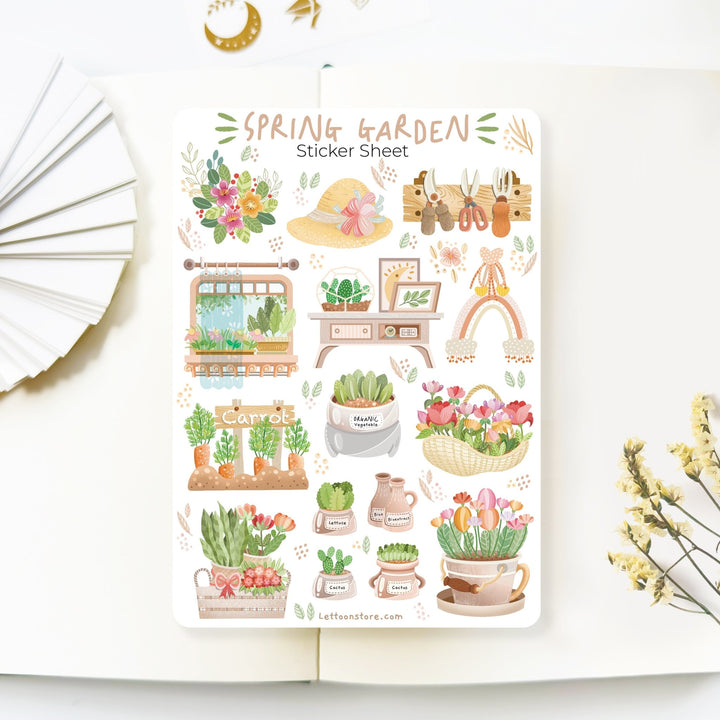 Premium Handmade Sticker Sheet Spring Garden 105mm x 148mm - a sheet on the table with a white flower branch, an opened notebook