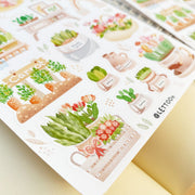 Premium Handmade Sticker Sheet Spring Garden 105mm x 148mm - 2 sheets on the table with an opened notebook