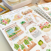 Premium Handmade Sticker Sheet Spring Garden 105mm x 148mm - a sheet on the table with an opened notebook