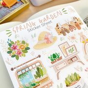 Premium Handmade Sticker Sheet Spring Garden 105mm x 148mm - a sheet on the table with an opened notebook