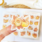 Premium Handmade Sticker Sheet Sweet Pumpkin 105mm x 148mm - a piece on finger and a sheet on the table 