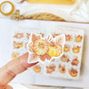 Premium Handmade Sticker Sheet Sweet Pumpkin 105mm x 148mm - a piece on finger and a sheet on the table 