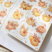 Premium Handmade Sticker Sheet Sweet Pumpkin 105mm x 148mm - 2 sheets on the table with an opened notebook