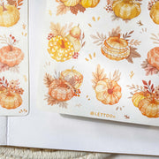 Premium Handmade Sticker Sheet Sweet Pumpkin 105mm x 148mm - 2 sheets on the table with an opened notebook